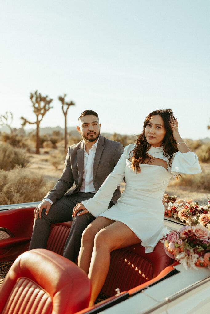 joshua treen engagement photoshoot of couple sitting in a vintage car