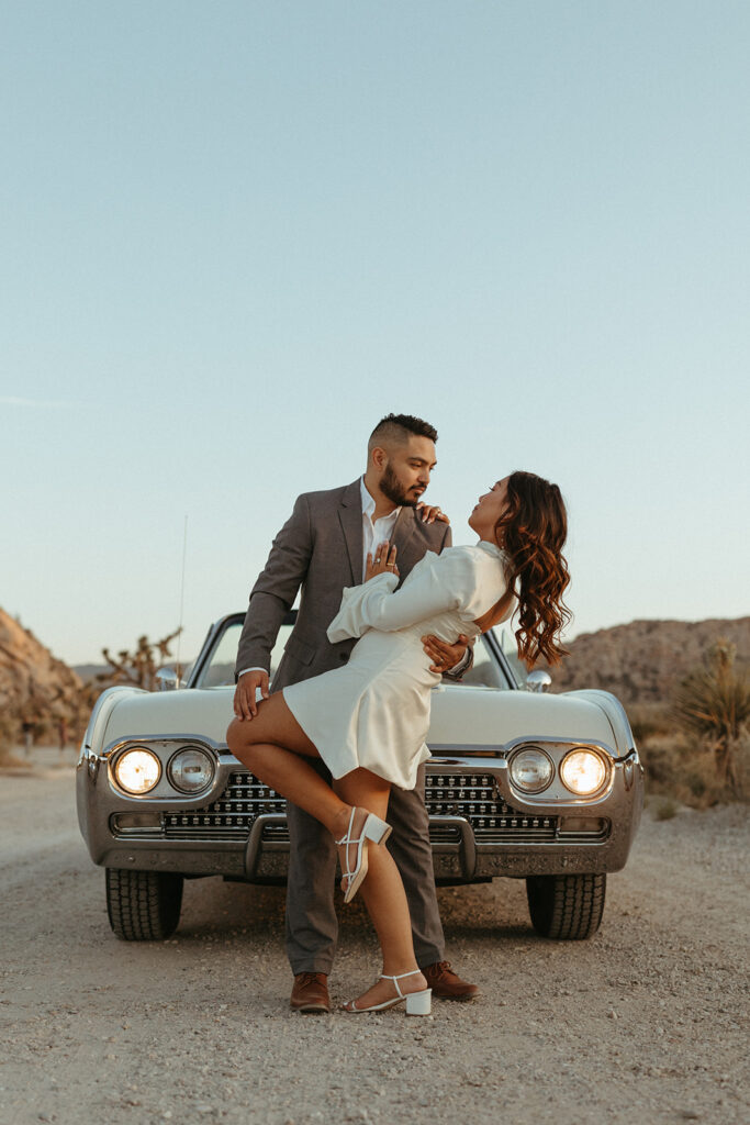 joshua treen engagement photoshoot of couple in front of a vintage car